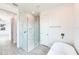 Bathroom showcasing glass enclosed shower, modern fixtures, and a standalone tub at 15698 Meacham Cir, Port Charlotte, FL 33981