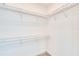 Spacious walk-in closet features custom shelving and ample storage at 15698 Meacham Cir, Port Charlotte, FL 33981