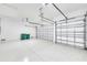 Spacious garage with epoxy floors, offering ample parking and storage at 15698 Meacham Cir, Port Charlotte, FL 33981