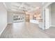 Spacious living room features a modern kitchen and seamless access to the outdoor pool area at 15698 Meacham Cir, Port Charlotte, FL 33981