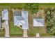 Expansive aerial view of the property highlighting the home, pool, detached garage, and large lot at 1761 Okolona St, North Port, FL 34287