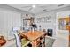 Bedroom with a large window, ceiling fan, and used as an office with wooden desk and bookshelves at 1761 Okolona St, North Port, FL 34287