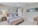 Comfortable bedroom featuring neutral walls, a bright window, ceiling fan and comfortable bedding at 1761 Okolona St, North Port, FL 34287