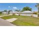 Well-maintained single-Gathering home with manicured lawn, and a spacious driveway at 1761 Okolona St, North Port, FL 34287
