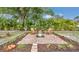 Relax in this backyard oasis, with a brick fire pit, mature landscaping and seating for you and your guests at 1761 Okolona St, North Port, FL 34287