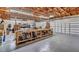 Spacious garage with exposed beams, offering ample workspace and storage at 1761 Okolona St, North Port, FL 34287