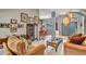 Bright and airy living room featuring tile flooring, glass top coffee table, and decorative furnishings at 1761 Okolona St, North Port, FL 34287