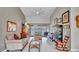 Comfortable living room with neutral tones, high ceilings, and natural light, perfect for relaxation at 1761 Okolona St, North Port, FL 34287