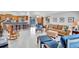 Open living area with breakfast bar, comfortable seating, and view of the pool at 1761 Okolona St, North Port, FL 34287