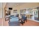 Covered patio with comfortable wicker furniture and views of the pool at 1761 Okolona St, North Port, FL 34287