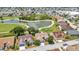 Aerial view of the community showcasing homes with a golf course and ponds at 1876 Birmingham Blvd, Punta Gorda, FL 33980