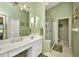 Bathroom with white vanity, shower, and tile flooring offers a clean and functional space at 1876 Birmingham Blvd, Punta Gorda, FL 33980