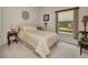 Bedroom with carpet flooring, light walls, and simple decor provides a peaceful atmosphere at 1876 Birmingham Blvd, Punta Gorda, FL 33980