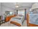 Bedroom features a tray ceiling, chandelier, and ample space for comfortable living and decor at 1876 Birmingham Blvd, Punta Gorda, FL 33980
