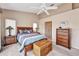 Cozy bedroom with vaulted ceilings, ceiling fan, and neutral decor creates a relaxing retreat at 1876 Birmingham Blvd, Punta Gorda, FL 33980