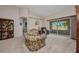 Cozy living room with plush seating, patio access, and natural light at 1876 Birmingham Blvd, Punta Gorda, FL 33980
