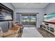Comfortable living room with scenic lake views, modern decor, and patio access at 1876 Birmingham Blvd, Punta Gorda, FL 33980