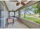 Covered patio featuring comfortable seating and views of the backyard and lake at 1876 Birmingham Blvd, Punta Gorda, FL 33980