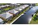 Aerial view of waterfront condos with boat docks, palm trees, and waterfront access at 2002 Bal Harbor Blvd # 1712, Punta Gorda, FL 33950