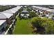 An aerial view of community featuring lush green spaces, a pool, and rows of well-maintained homes at 2002 Bal Harbor Blvd # 1712, Punta Gorda, FL 33950