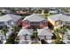 Aerial view of colorful two-story homes with gray roofs and palm trees along canals at 2002 Bal Harbor Blvd # 1712, Punta Gorda, FL 33950