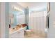 Bathroom with a single sink vanity, toilet, and shower with a white shower curtain at 2002 Bal Harbor Blvd # 1712, Punta Gorda, FL 33950