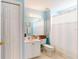 Freshly painted bathroom with a white vanity, toilet, and shower with a white curtain at 2002 Bal Harbor Blvd # 1712, Punta Gorda, FL 33950