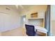 Bedroom with a built-in desk and storage, neutral carpet, and a window at 2002 Bal Harbor Blvd # 1712, Punta Gorda, FL 33950