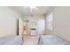 Bedroom features twin beds, neutral paint, a window and a door at 2002 Bal Harbor Blvd # 1712, Punta Gorda, FL 33950