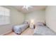 Bedroom features twin beds, neutral paint, and a ceiling fan at 2002 Bal Harbor Blvd # 1712, Punta Gorda, FL 33950