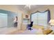 Comfortable bedroom featuring a built-in desk, soft decor, and natural light from the window at 2002 Bal Harbor Blvd # 1712, Punta Gorda, FL 33950