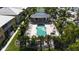 Community pool and hot tub surrounded by lush landscaping and comfortable seating areas; beautiful spot to relax at 2002 Bal Harbor Blvd # 1712, Punta Gorda, FL 33950