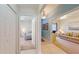 View of a hallway leading to a bedroom and living space with neutral paint and tile flooring at 2002 Bal Harbor Blvd # 1712, Punta Gorda, FL 33950