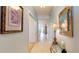 Inviting hallway with decorative mirror, tiled floor, and view of the living area enhancing the home's appeal at 2002 Bal Harbor Blvd # 1712, Punta Gorda, FL 33950