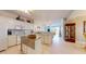 Bright white kitchen with a center island and open layout to the living area, great for entertaining at 2002 Bal Harbor Blvd # 1712, Punta Gorda, FL 33950