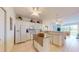 Bright kitchen with white cabinets, tiled floors, modern appliances, and an open design for seamless entertaining at 2002 Bal Harbor Blvd # 1712, Punta Gorda, FL 33950
