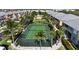 Well-maintained tennis court surrounded by lush landscaping, providing a perfect recreational amenity for residents at 2002 Bal Harbor Blvd # 1712, Punta Gorda, FL 33950