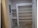 Spacious pantry with ample shelving for storage, enhancing organization at 21275 Austin Ave, Port Charlotte, FL 33952