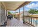 Covered back porch with outdoor seating, railing, and access to the pool area at 22349 Columbus Ave, Port Charlotte, FL 33954