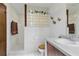 Bright bathroom showcasing tile floors, a tiled glass block shower and wood vanity at 22349 Columbus Ave, Port Charlotte, FL 33954