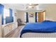 Bright bedroom featuring neutral walls, hardwood floors and ceiling fan at 22349 Columbus Ave, Port Charlotte, FL 33954