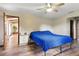 Bedroom featuring natural light, light walls, hardwood floors and ceiling fan at 22349 Columbus Ave, Port Charlotte, FL 33954