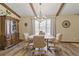 Dining room with wooden table and chairs set beneath decorative beamed ceiling at 22349 Columbus Ave, Port Charlotte, FL 33954