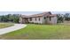 Well-maintained home showing off its green lawn and mature landscaping at 22349 Columbus Ave, Port Charlotte, FL 33954