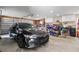 Spacious garage interior with car, motorcycle, tool storage, and ample workspace at 22349 Columbus Ave, Port Charlotte, FL 33954