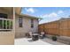 Outdoor patio area with seating and privacy fencing, perfect for relaxing and entertaining at 22349 Columbus Ave, Port Charlotte, FL 33954