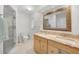 Bathroom with a shower, toilet, vanity with double sinks, and a granite countertop at 22353 Blanchard Ave, Port Charlotte, FL 33952