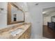 Bathroom featuring a vanity with double sinks, a granite countertop, and tiled floors at 22353 Blanchard Ave, Port Charlotte, FL 33952