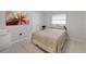 Bedroom featuring a double bed, window, and neutral wall color at 22353 Blanchard Ave, Port Charlotte, FL 33952