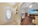 Bright foyer with decorative glass door and archway leading into the living area at 22353 Blanchard Ave, Port Charlotte, FL 33952